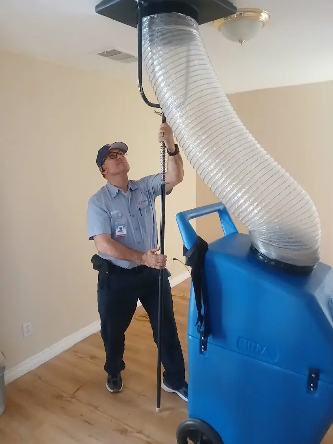 Furnace Tune-Up technician using HEPA equipment in Menomonee Falls